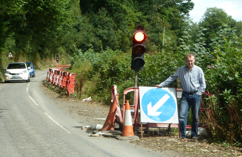 Simon Hart MP at the Meidrim “temporary” traffic lights which went up in 2012.